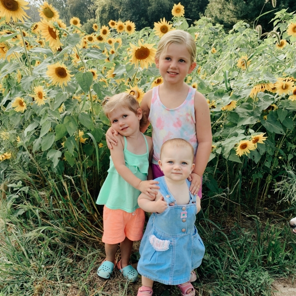 Kids and sunflowers